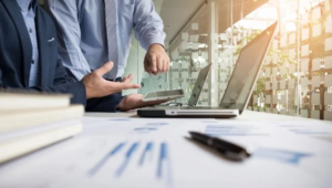business-adviser-analyzing-financial-figures-denoting-progress-work-company-640x363